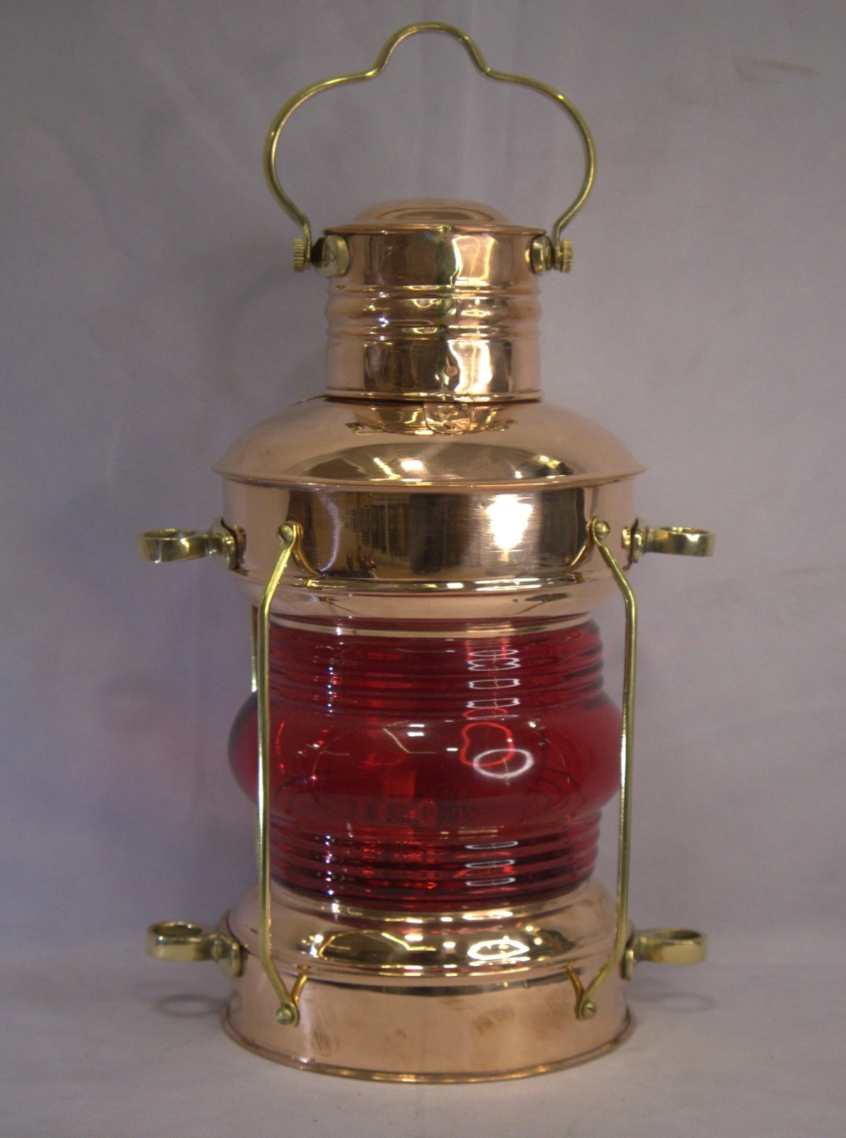 Antique copper and brass ship’s lantern with red glass lens and Leeds & Burton Southampton Antique copper and brass ship’s lantern with red glass lens and Leeds & Burton Southampton