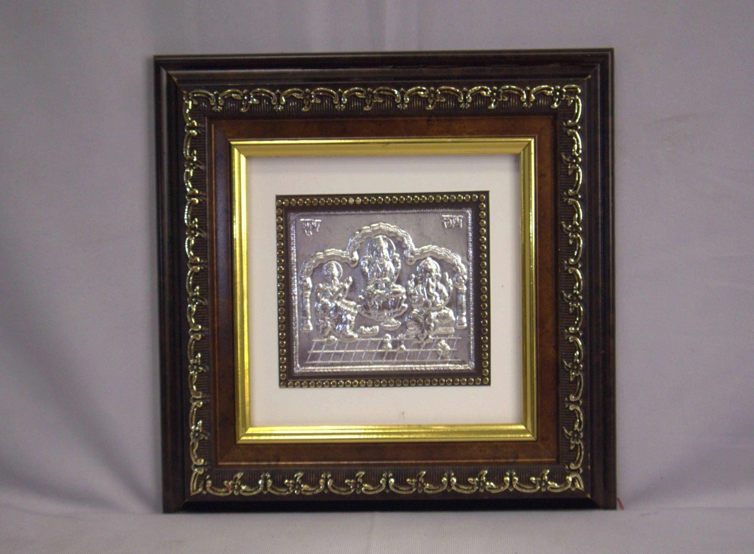 Silver Lakshmi Ganesha Saraswati wooden photo frame Silver Lakshmi Ganesha Saraswati wooden photo frame