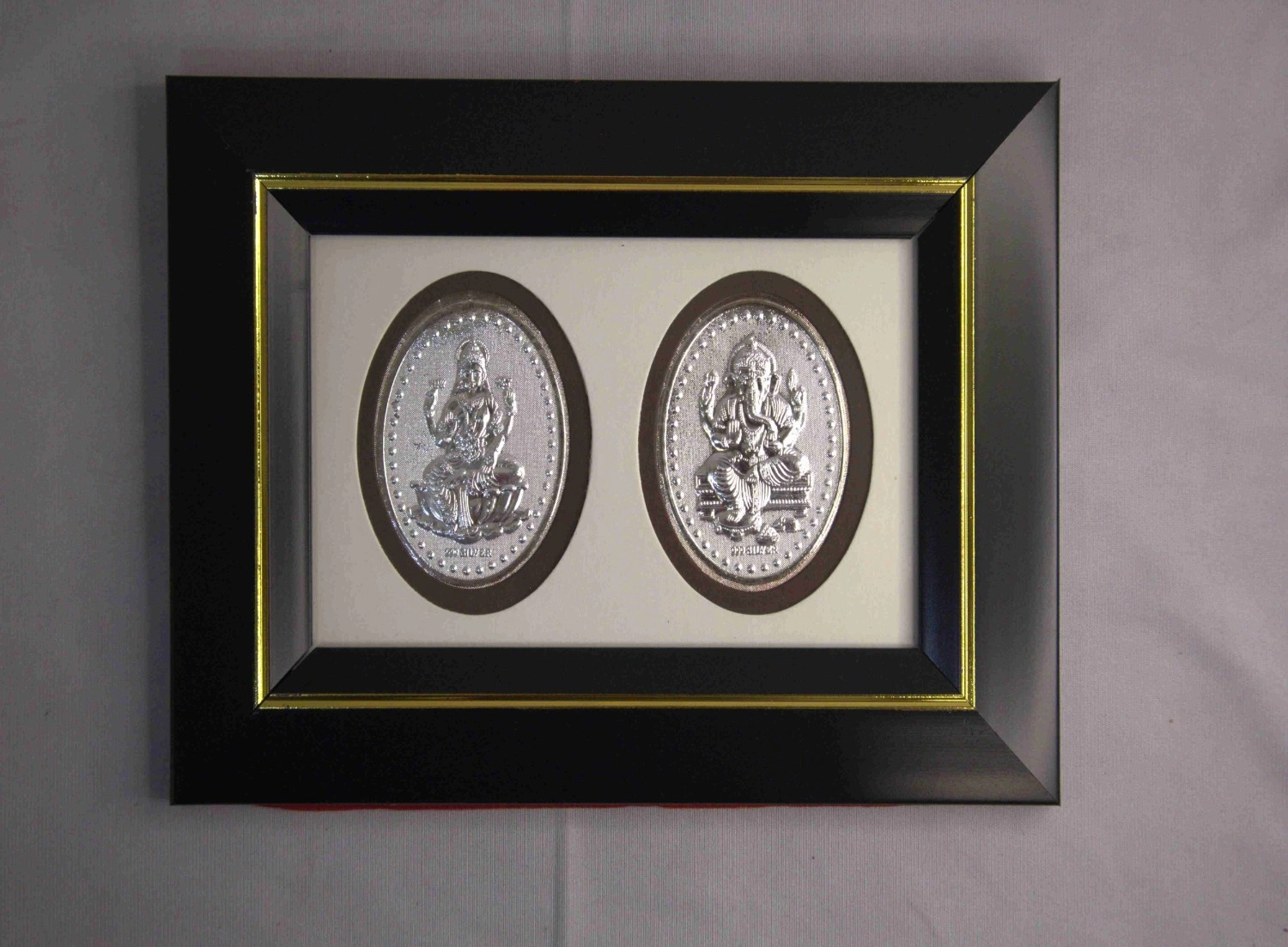 Silver Lakshmi Ganesha black wooden photo frame Silver Lakshmi Ganesha black wooden photo frame