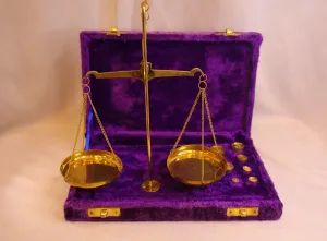 Antique brass balance scale with calibration weights